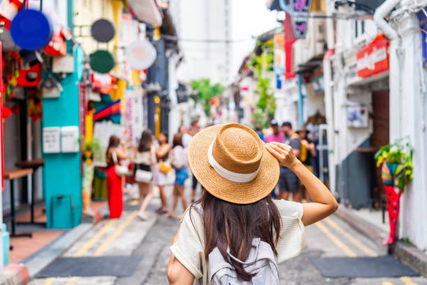 young-woman-tourist-with-backpack-walking-at-haji-lane-in-singapore.jpg